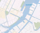 Map showing a section of Copenhagen, Denmark, with streets, waterways, and the label Hansbrobløbet. The area includes urban blocks and canals, highlighting a mix of land and waterway infrastructure.